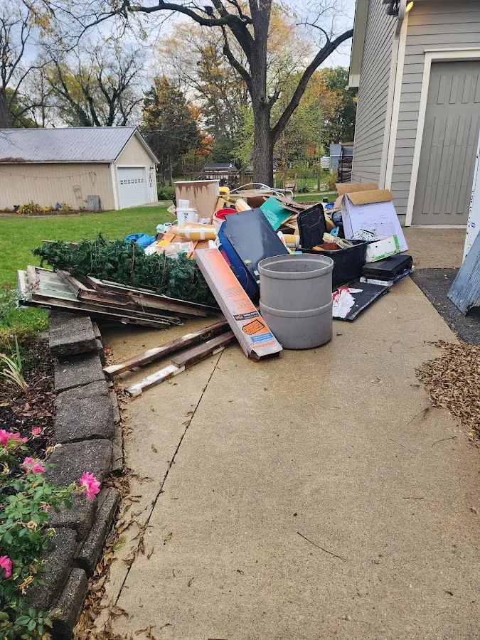 Dumpster being loaded with debris for Demolition Dumpster Rental in Blair
